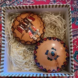 Hand crafted round wooden containers from Romania with lids in a gift box.